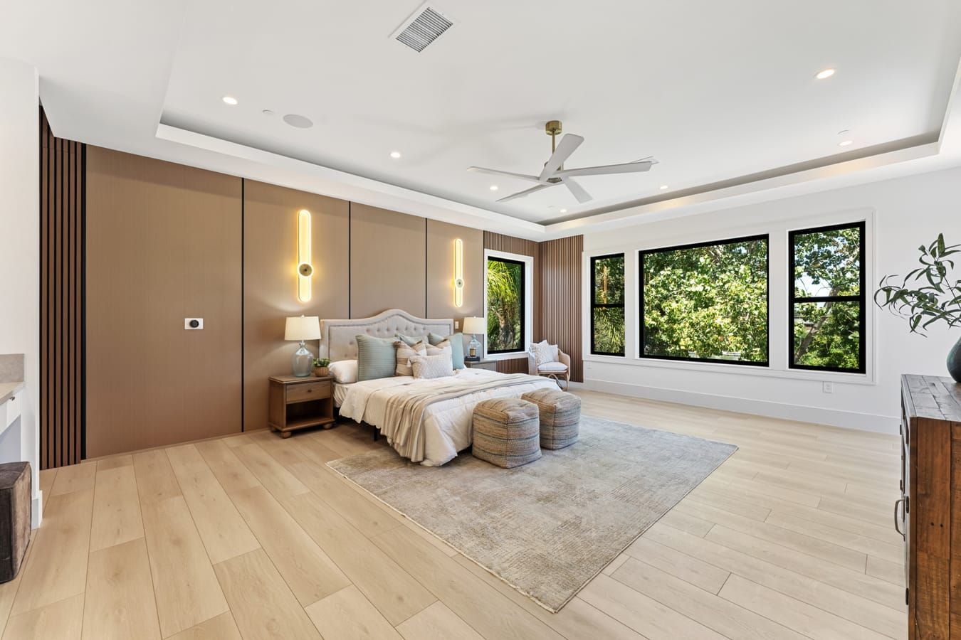 Primary bedroom with wood accent wall